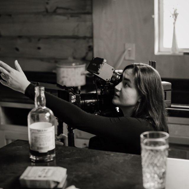 a lady behind the lens